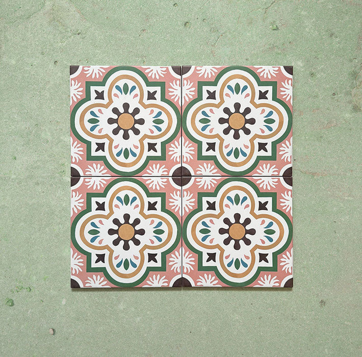 Cabana Paradise 20x20cm Moroccan-style ceramic tiles shown as a four-tile display, featuring a pink, green, and mustard floral pattern on a soft green background.