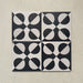 Group image showing four Geometry Illusion Noir 20x20cm geometric patterned tiles arranged to create a symmetrical circular repeat, featuring bold black and cream semicircles, photographed against a textured neutral background.