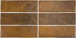 Vista cenital de azulejos de pared cerámicos Zellij Dorado Ladrillo 6,5 × 20 cm de estilo marroquí, mostrando tonos dorados cálidos y terrosos con rica variación, un acabado brillante ligeramente texturizado y bordes suavemente irregulares para un aspecto artesanal auténtico.
