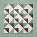 Group layout of Geometry Angles Patterned Tiles in 20cm x 20cm, arranged in a repeating geometric pattern featuring green, white, and black triangular shapes forming interlocking diamond motifs, displayed on a textured green background.