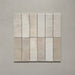 Vista cenital de azulejos de pared cerámicos Zellij Ocre Ladrillo 6,5 × 20 cm de estilo marroquí, dispuestos en cuadrícula, mostrando una suave variación tonal, bordes irregulares y un acabado brillante con efecto artesanal en tonos neutros cálidos sobre un fondo liso.