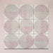 Kasuf Rose 20x20cm terrazzo-style decor tiles featuring a soft pink and neutral circular pattern with speckled terrazzo detailing, ideal for adding a playful yet elegant geometric look to contemporary interiors.