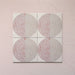 Kasuf Rose 20x20cm terrazzo-style decor tiles featuring a soft pink and neutral circular pattern with speckled terrazzo detailing, ideal for adding a playful yet elegant geometric look to contemporary interiors.