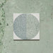 Kasuf Verde 20x20cm terrazzo-style decor tiles featuring a soft sage green and pale blue circular pattern with speckled terrazzo detailing, perfect for creating calming geometric floors and contemporary statement interiors.