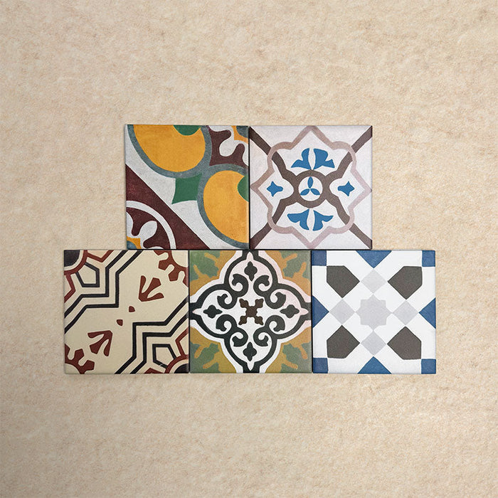 Fihrdos Mini Patchwork Moroccan-style 15x15cm patterned porcelain tiles arranged in a grouped layout, showcasing a mix of colourful geometric and traditional decorative designs.