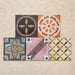 Conjunto de baldosas cerámicas Cabana Patchwork de estilo marroquí 20x20 cm en disposición agrupada, mostrando una combinación multicolor de diseños geométricos y florales en composición patchwork de inspiración vintage.
