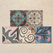 Conjunto de baldosas cerámicas Cabana Patchwork de estilo marroquí 20x20 cm en disposición agrupada, mostrando una combinación multicolor de diseños geométricos y florales en composición patchwork de inspiración vintage.