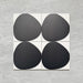 Pebble Beach Reversed Black 20x20cm patterned tiles featuring a bold black organic circular design, ideal for creating striking monochrome floors and statement walls with a contemporary geometric aesthetic.