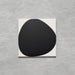 Pebble Beach Reversed Black 20x20cm patterned tiles featuring a bold black organic circular design, ideal for creating striking monochrome floors and statement walls with a contemporary geometric aesthetic.