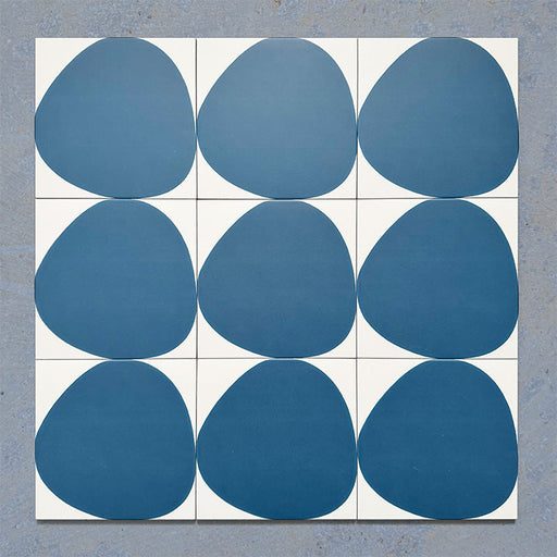 Pebble Beach Reversed Blue 20x20cm patterned tiles featuring a bold deep blue organic circular design, ideal for creating playful statement walls and contemporary patterned floors with a modern geometric feel.