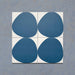 Pebble Beach Reversed Blue 20x20cm patterned tiles featuring a bold deep blue organic circular design, ideal for creating playful statement walls and contemporary patterned floors with a modern geometric feel.