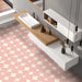 Contemporary bathroom featuring Pebble Beach Reversed Pink 20x20cm patterned floor tiles, styled with soft blush tones, floating oak cabinetry, and minimalist white fittings for a playful modern interior.