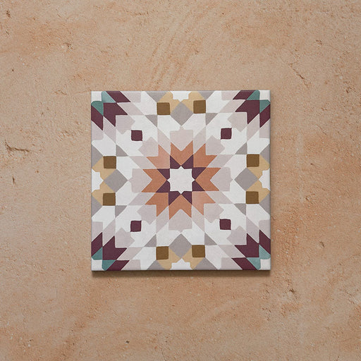 Cabana Manzanillo 20x20cm Moroccan-style porcelain tile featuring an intricate geometric star pattern in blush pink, mustard, terracotta, lilac, and turquoise tones on a soft matt finish background