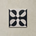 Single tile image showing the Geometry Illusion Noir 20x20cm geometric patterned tile with black and cream semicircles arranged in a bold symmetrical motif, photographed against a textured neutral background.