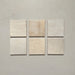 Vista cenital de azulejos de pared cerámicos Zellij Ocre Cuadrado 13,2 × 13,2 cm de estilo marroquí, presentados como piezas individuales, destacando la variación tonal suave, los bordes ligeramente irregulares y el acabado brillante artesanal en tonos neutros cálidos sobre un fondo liso.