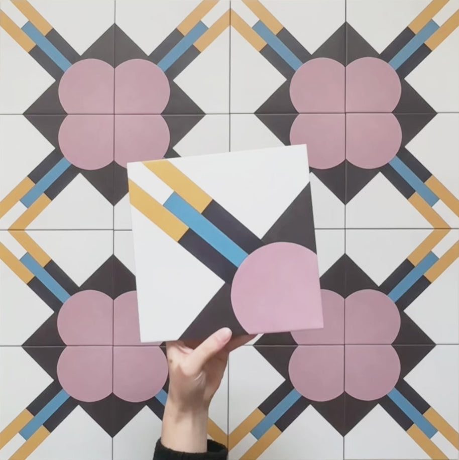 Geometry Contour patterned tile in a 20x20cm size shown as a single tile, featuring a bold geometric design with a mauve semicircle, black and white diagonal sections, and mustard, teal, and navy linear accents.