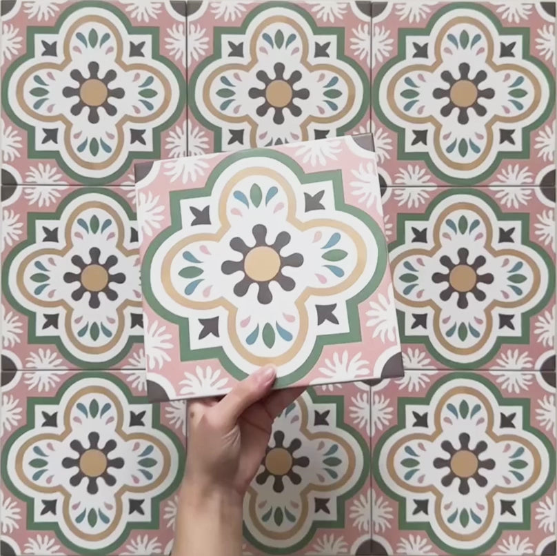 Cabana Paradise 20x20cm Moroccan-style ceramic tile shown as a single piece, featuring a multicolour floral pattern with pink, green, and mustard tones on a soft green background.