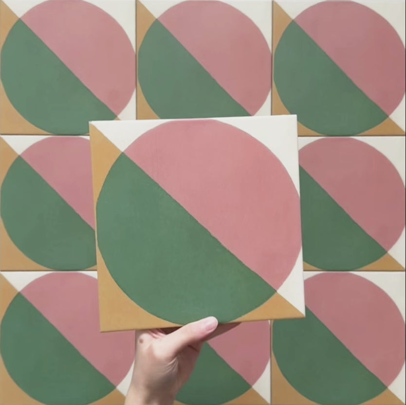 Geometry Paloma 20x20cm geometric patterned tile with pink and green semicircles and mustard and cream corner details.