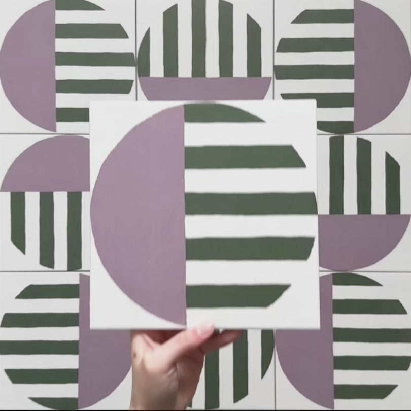 Geometry Seritina 20x20cm patterned tile with green horizontal stripes and a mauve semicircle on a cream base.