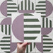 Geometry Seritina 20x20cm patterned tile with green horizontal stripes and a mauve semicircle on a cream base.
