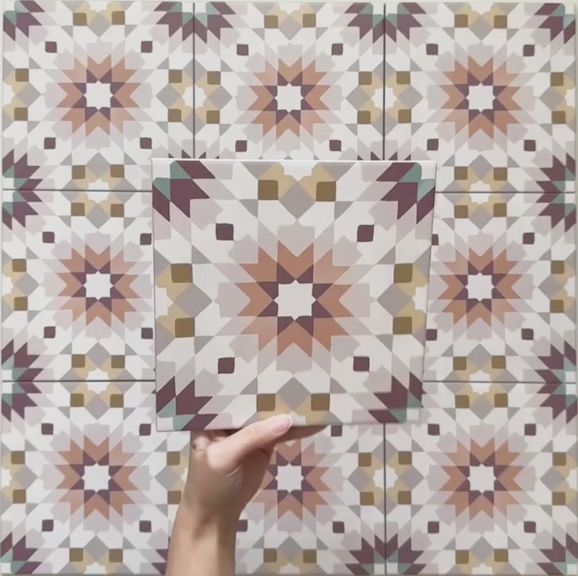 Cabana Manzanillo 20x20cm Moroccan-style porcelain tile featuring an intricate geometric star pattern in blush pink, mustard, terracotta, lilac, and turquoise tones on a soft matt finish background