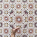 Cabana Manzanillo 20x20cm Moroccan-style porcelain tile featuring an intricate geometric star pattern in blush pink, mustard, terracotta, lilac, and turquoise tones on a soft matt finish background