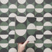 Geometry Circulo 20x20cm geometric patterned tile with green, black, and cream semicircle motifs
